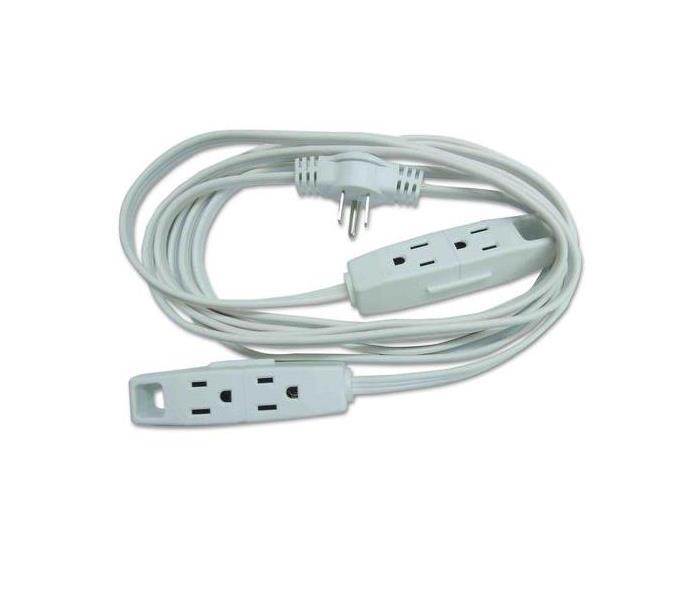 A White Extension cord with two ends.